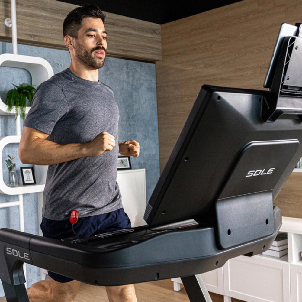 sole f89 treadmill person running front view