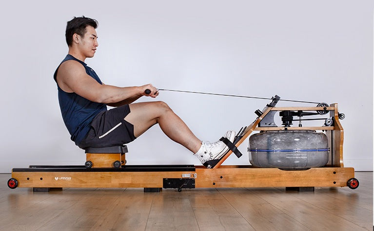 Lifespan Fitness ROWER-760 Foldable Water Rowing Machine with a user in action, showcasing its ergonomic design and water resistance for effective home workouts.