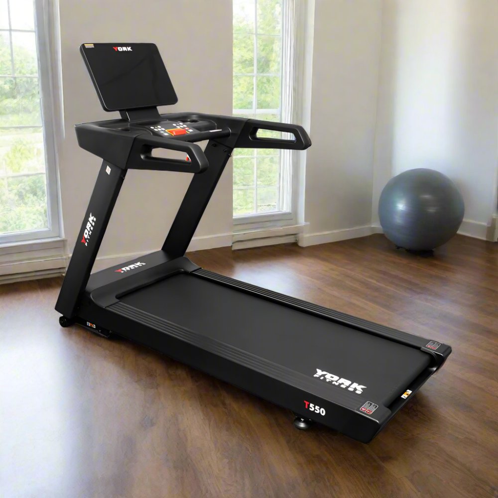 York T550 treadmill in a spacious living room with large windows