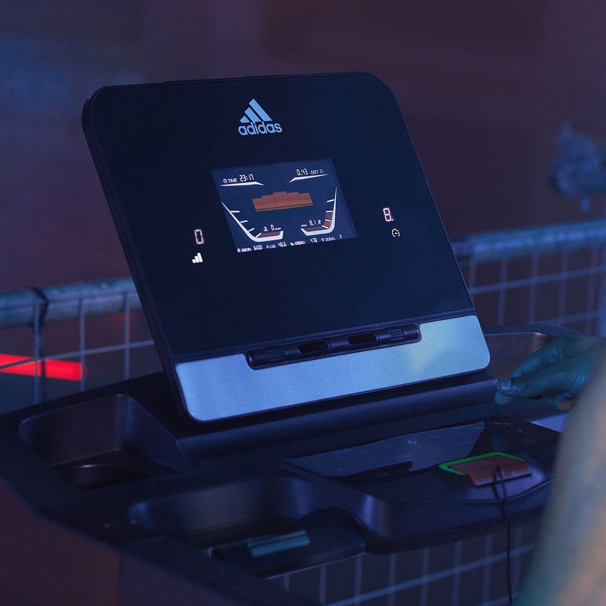 Adidas T-19 treadmill featuring a sleek design, adjustable speed settings, and a digital display for tracking workouts, perfect for home fitness enthusiasts.