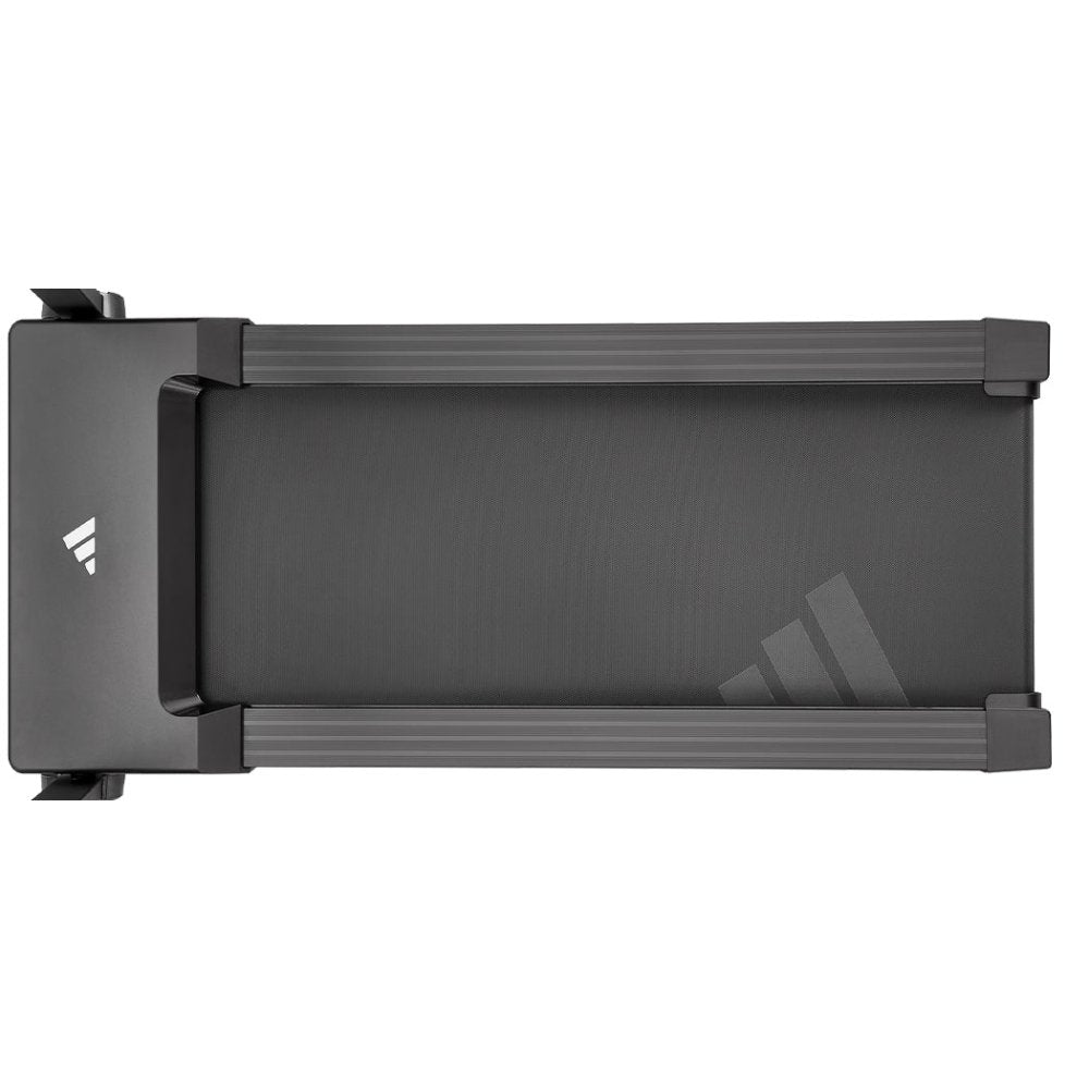 Man running on a sleek modern treadmill in a stylish home gym setting