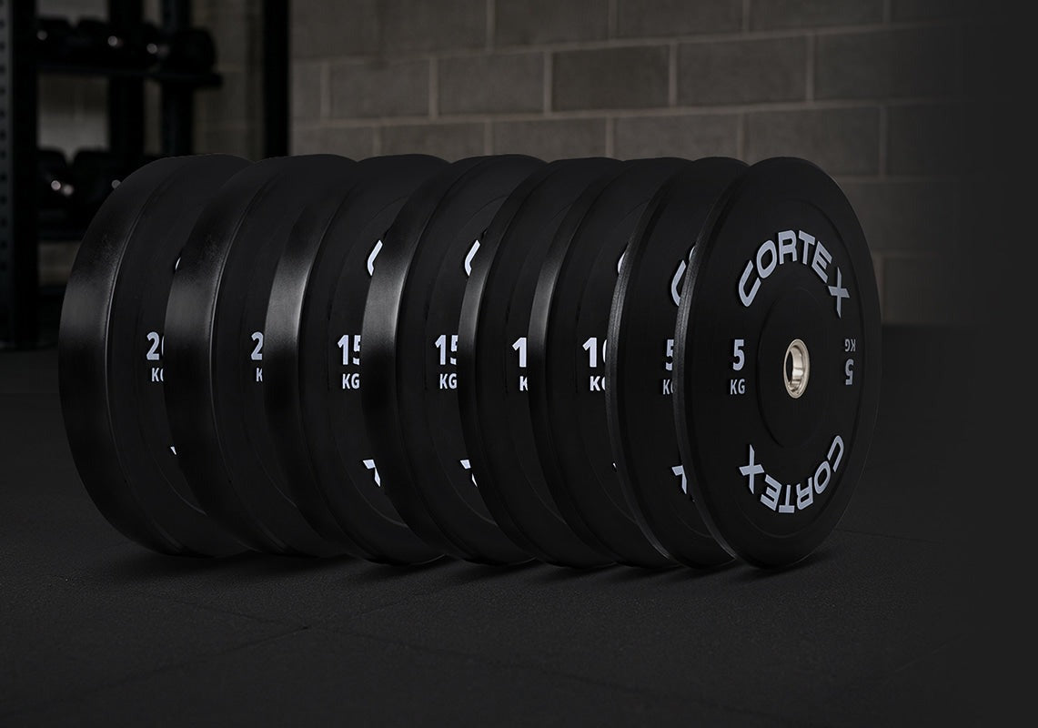 Cortex 120kg Black Series V3 Bumper Plate Set Incl. SPARTAN205 Hard Chrome 7ft 20kg Olympic Barbell - designed for durability and safety in weightlifting, featuring a sleek black design and protective rubber surface.