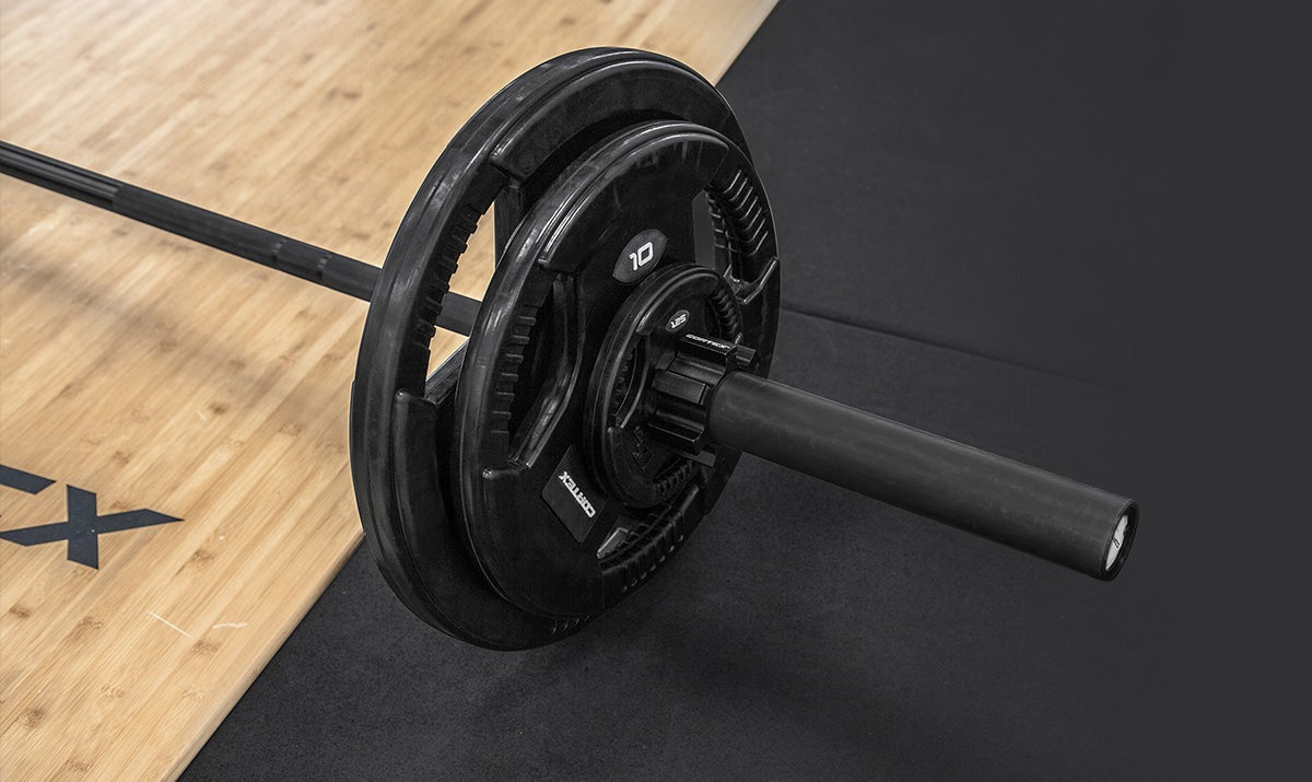 Cortex 35kg Tri-Grip V2 50mm Rubber Olympic Plate Set featuring two 5kg plates with ergonomic tri-grip design, ideal for strength training and fitness enthusiasts.