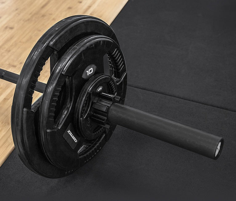 Cortex 80kg Tri-Grip V2 50mm Rubber Olympic Plate Set featuring four durable, black rubber plates with easy-grip handles for efficient weightlifting and strength training.