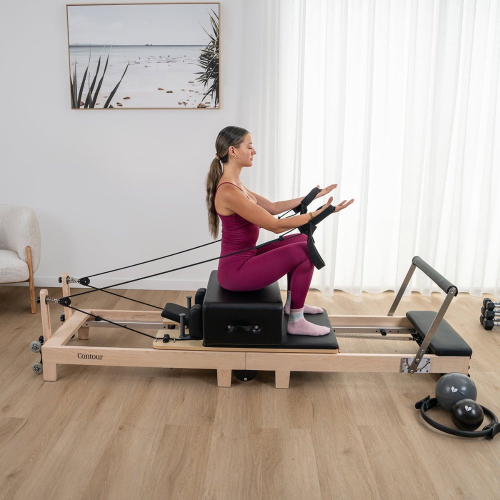 Lifespan Fitness Contour 2 Folding Wood Pilates Reformer with adjustable padded platform and wheels, ideal for home workouts and Pilates training.