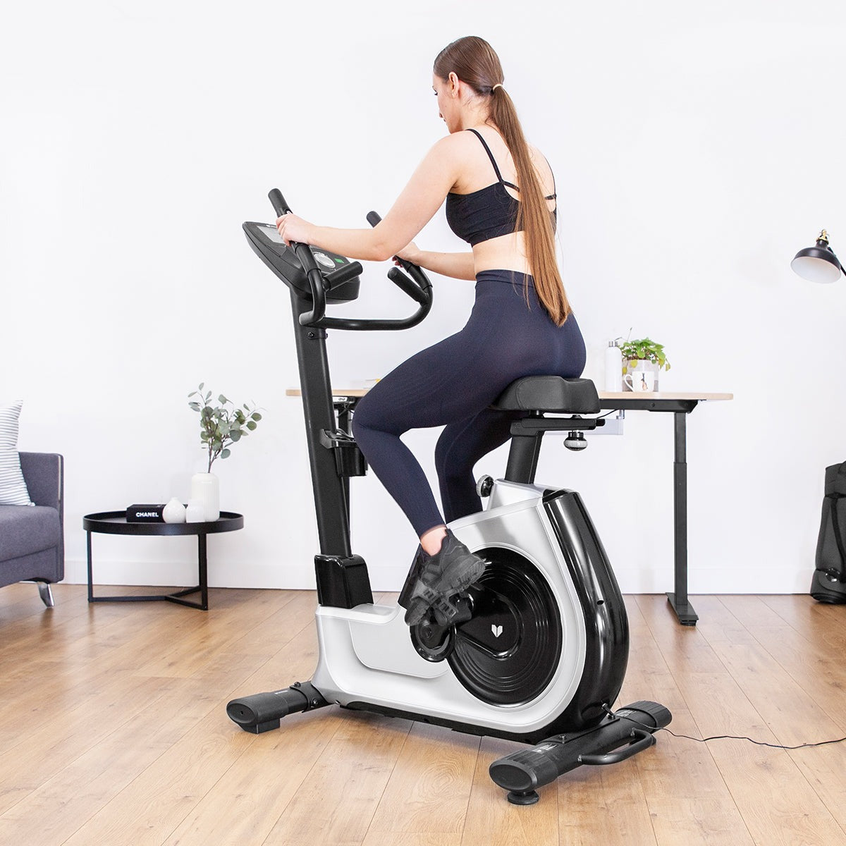 Lifespan Fitness EXC-100 Commercial Exercise Bike featuring adjustable seat, multi-functional handlebars, and a sleek design, ideal for home workouts and fitness enthusiasts.