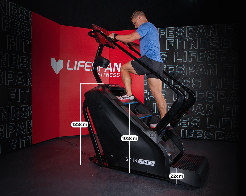 A user exercising on the Lifespan Fitness ST-15 Vertex commercial stair climber, showcasing its 4 level adjustable resistance and ergonomic design suitable for gym enthusiasts.