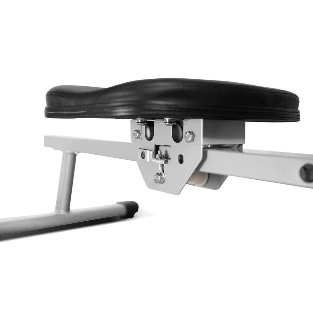 Features of a rowing machine: transport wheels, contoured seat, padded row handle