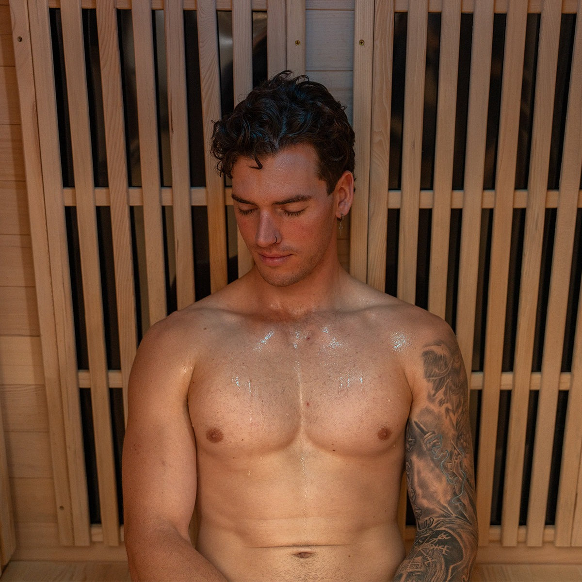 ReGen8 infrared sauna featuring three glass doors and warm wooden interior for wellness benefits