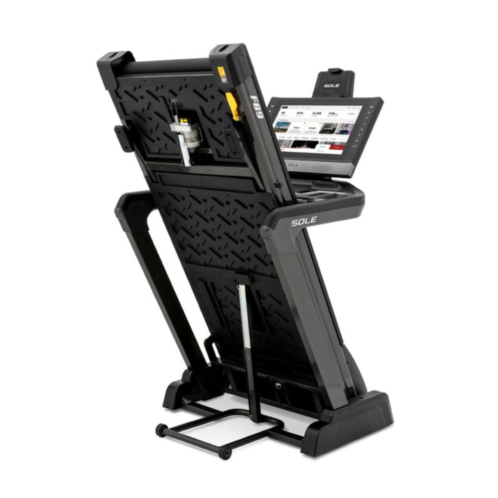 Sole F89 Treadmill folded angle view with screen showing