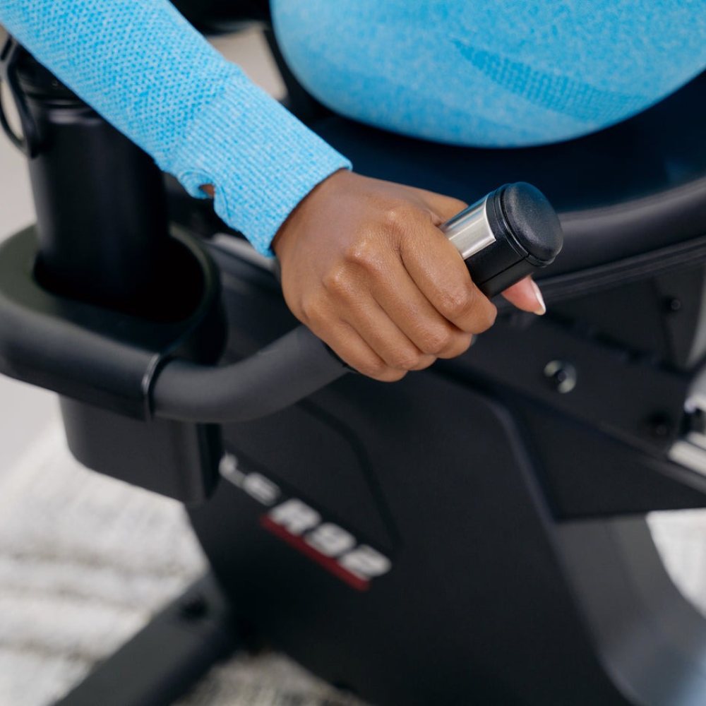 Sole fitness recumbent bike in a stylish home setting with modern decor