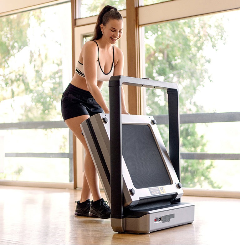 Woman jogging on a sleek treadmill in a stylish home gym with natural light